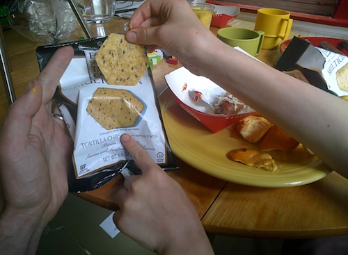 Tortilla chip and bag with picture of chip. 